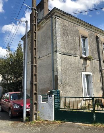 Restauration de façade à la chaux et pierres de Tuffeau